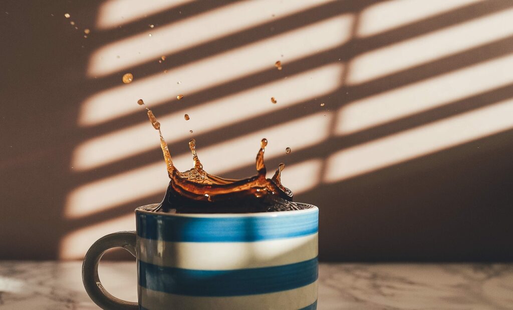 drinking black coffee daily, splash into coffee with enthusiasm