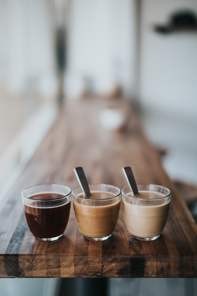 Espresso drinks customized with different amounts of milk. Black, splash of milk, heavy splash of milk.