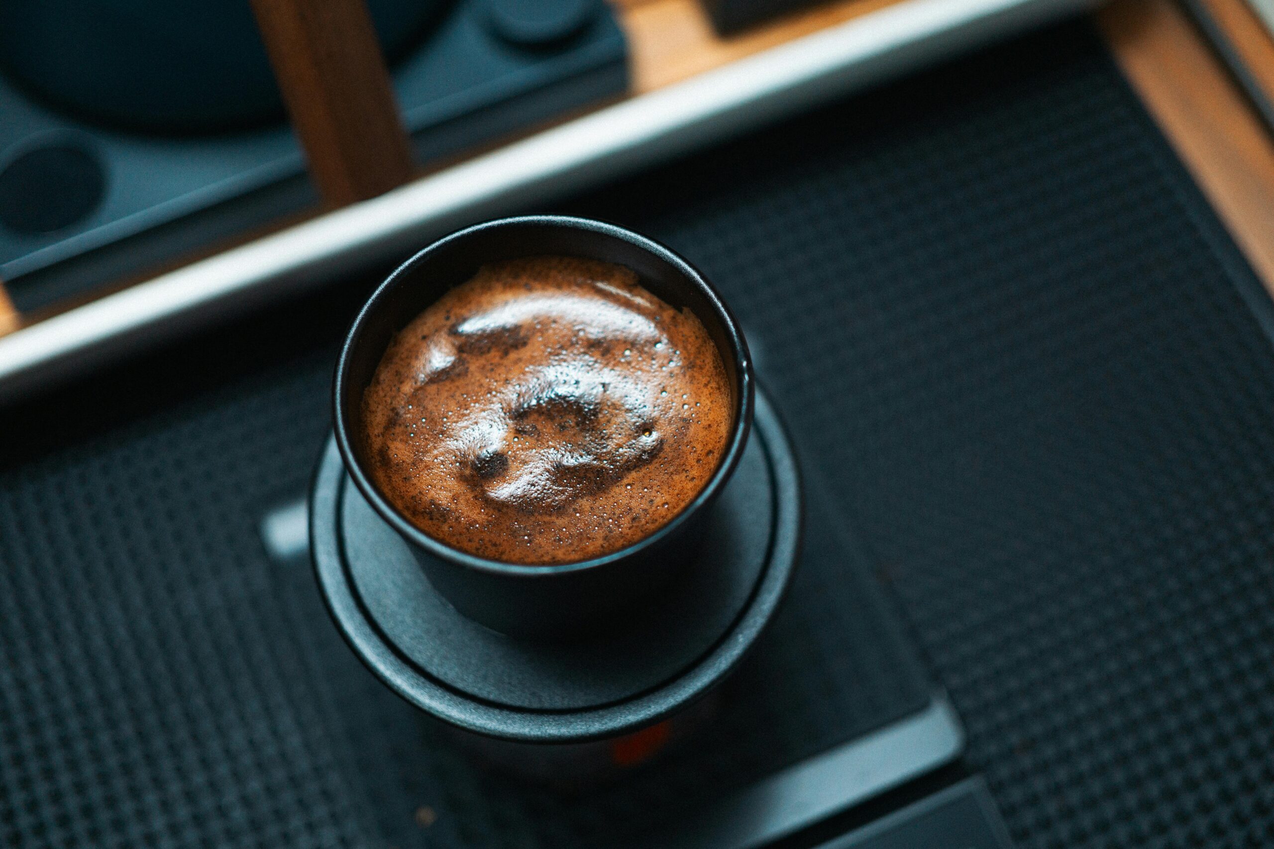 coffee cupping, black coffee cup mug on black table, close up shot